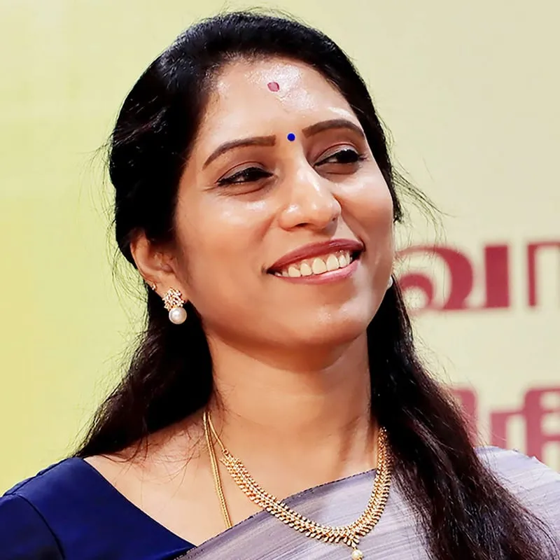 S. Nisha Senthil Kumar, smiling.